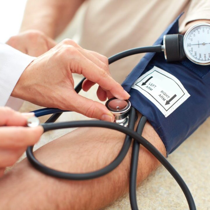 Blood pressure measuring. Doctor and patient.  Health care.
